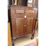 An early 20th Century mahogany gramophone cabinet, the doors raised and fielded panels,