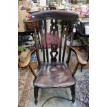 A Victorian high backed Windsor armchair