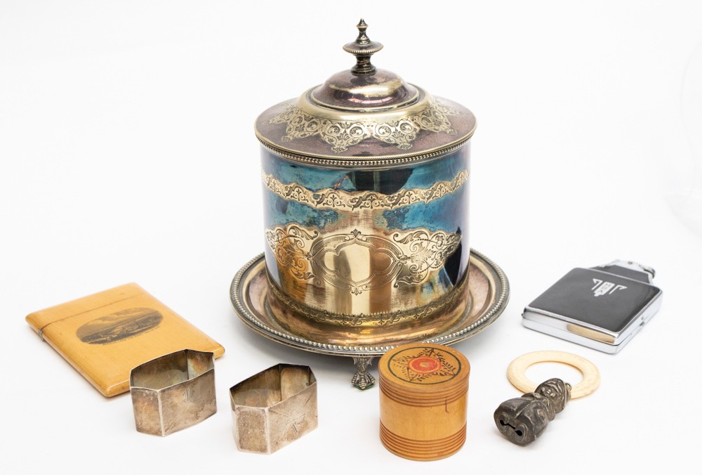 A Mauchline ware ceiling card case, treen vessel, cigarette lighter, two silver napkin rings,