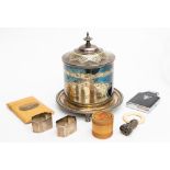 A Mauchline ware ceiling card case, treen vessel, cigarette lighter, two silver napkin rings,