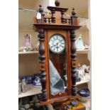 A 19th Century eight day Vienna wall clock, with white enamelled dial and black Roman numerals,