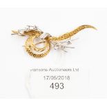 An 18ct gold and diamond set brooch,