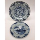An 18th Century blue and white Chinese plate with European tin glazed blue and white smaller plate