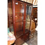 A pair of Stag display cabinets, each fitted with two doors,