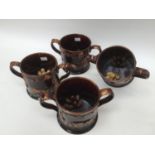 Set of four frog mugs, loving cups, late 19th century,