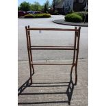 An Edwardian oak towel rail together with a small pedestal wine table (2)