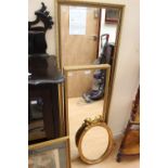 Three gilt framed mirrors, two large,