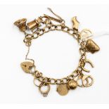 A 9ct gold charm bracelet with twelve charms including an anchor, fork,