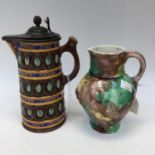 A Wedgwood majolica jug with mottled green, brown and yellow glaze a/f,