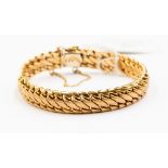 A 9ct gold fancy link bracelet, length approx 7.5'', with safety chain, weight 17.