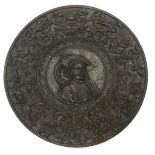 A bronze plaque, raised decoration,