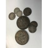 A collection of coins including 1893 Crown, 1935 Crown,