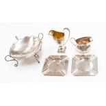 A silver jug, Birmingham, 1905; together with another, two silver ashtrays,