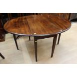 An early 20th Century mahogany drop leaf dining table