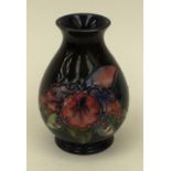 A small Moorcroft vase,