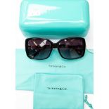 A pair of Tiffany sunglasses with crystal sides