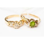 A peridot and diamond three stone 9ct gold dress ring;