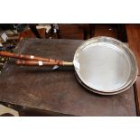 Two copper pans with silver plated linings (2)