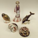 A Royal Crown Derby 'Dione' from the classic figure collection, four Royal Crown Derby paperweights,