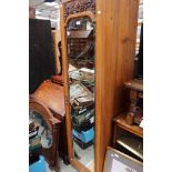 An Edwardian satin walnut mirrored single door wardrobe