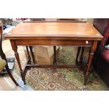 A late Victorian Aesthetic mahogany swivelling fold over card table, inlaid top,