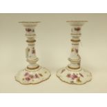 A pair of Royal Crown Derby candlesticks, hand painted floral and insect pattern, reg no.