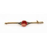 A padparadscha sapphire and yellow metal probably 14ct gold brooch,