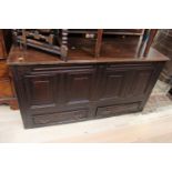 A George II joined oak mule chest, the plank top enclosing storage section,