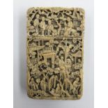 A late 19th Century Chinese ivory calling card case, carved in high relief to all sides,