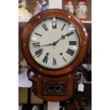 A late 19th Century walnut eight day wall clock,