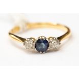 A sapphire and diamond three stone ring, claw set in yellow metal, probably 18ct gold, size K,