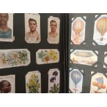 An album containing pre 1920 sets/part sets of cigarette cards, chromolithographic,