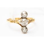 An Edwardian diamond ring, with three diamonds set to the length of the finger, 'the past,