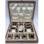 A case Copeland china coffee set, six cups and saucers, blue ground with gilt,