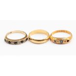A group of three gold rings, comprising one 18ct wedding band, approx 2.