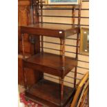 A George IV mahogany four tier whatnot, circa 1830, the top shelf set back,