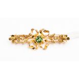 A green tourmaline and seed pearl brooch with ribbon flower design set with seed pearls,