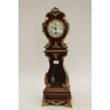 A 19th Century French clock with applied brass decoration, retailed by London firm,