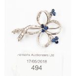 A sapphire and diamond 'Clover Brooch' openwork with three clusters each of three round-cut