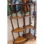 A pair of Victorian walnut corner what-nots, each of four tier form,