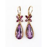 A pair of 9ct gold, amethyst and garnet drop earrings, comprising pear shaped amethysts,