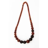 A graduated amber necklace, various colours, 47.