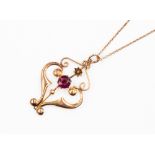 An Art Nouveau 9ct gold and paste set pendant on chain and chain with barrel clasp with a length of