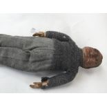 A felt body doll, maker unknown, head made of papier mache, as found, 16"/41cm approx.