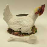 An Italian porcelain egg basket, late 20th Century in the form of a chicken upon nest,