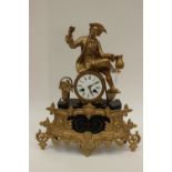 A gilt metal and slate figural French clock,