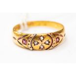 A Victorian 15ct gold ruby and diamond gypsy set dress ring,