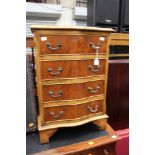 A George III style mahogany four drawer chest, or small proportions, serpentine form,