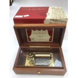 A boxed Reuge music, table top cylinder music box,