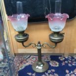 A double oil lamp, brass with Corinthian column,